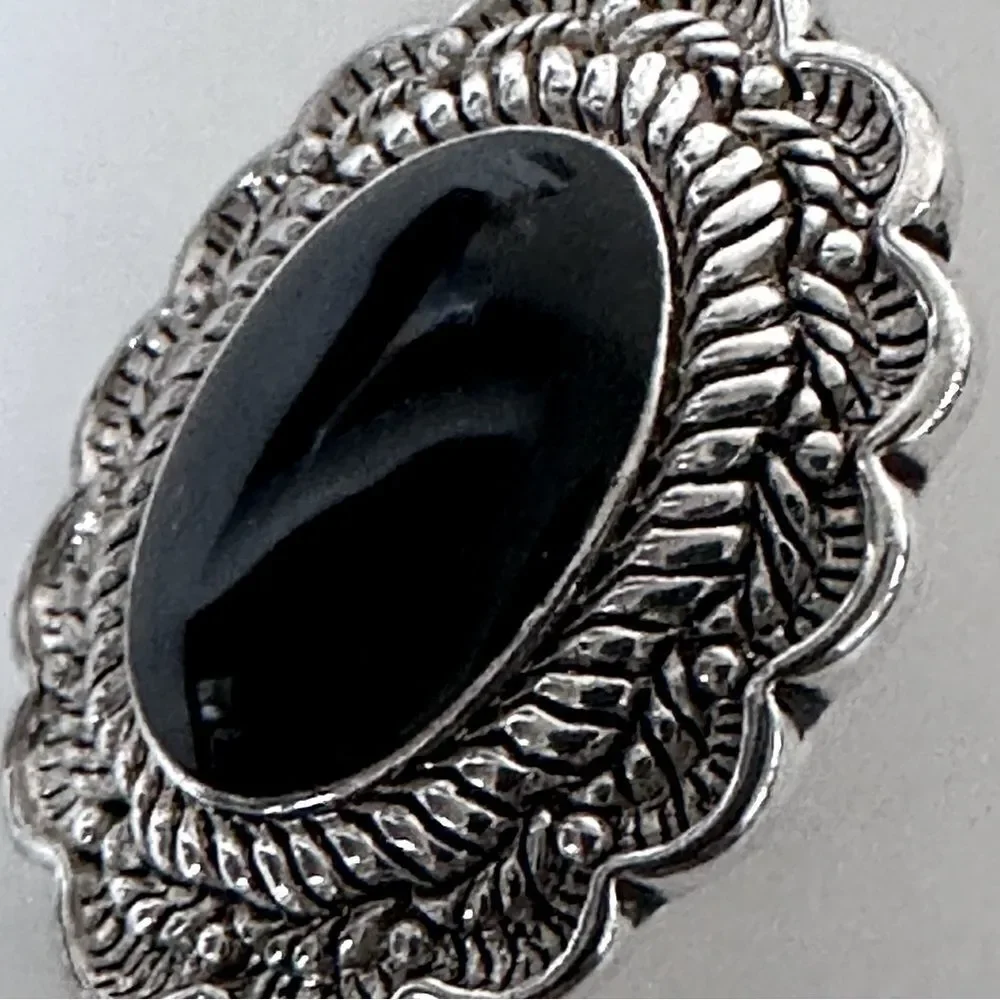 Vintage Sterling Silver Oval Clip-On Earrings with a black stone.